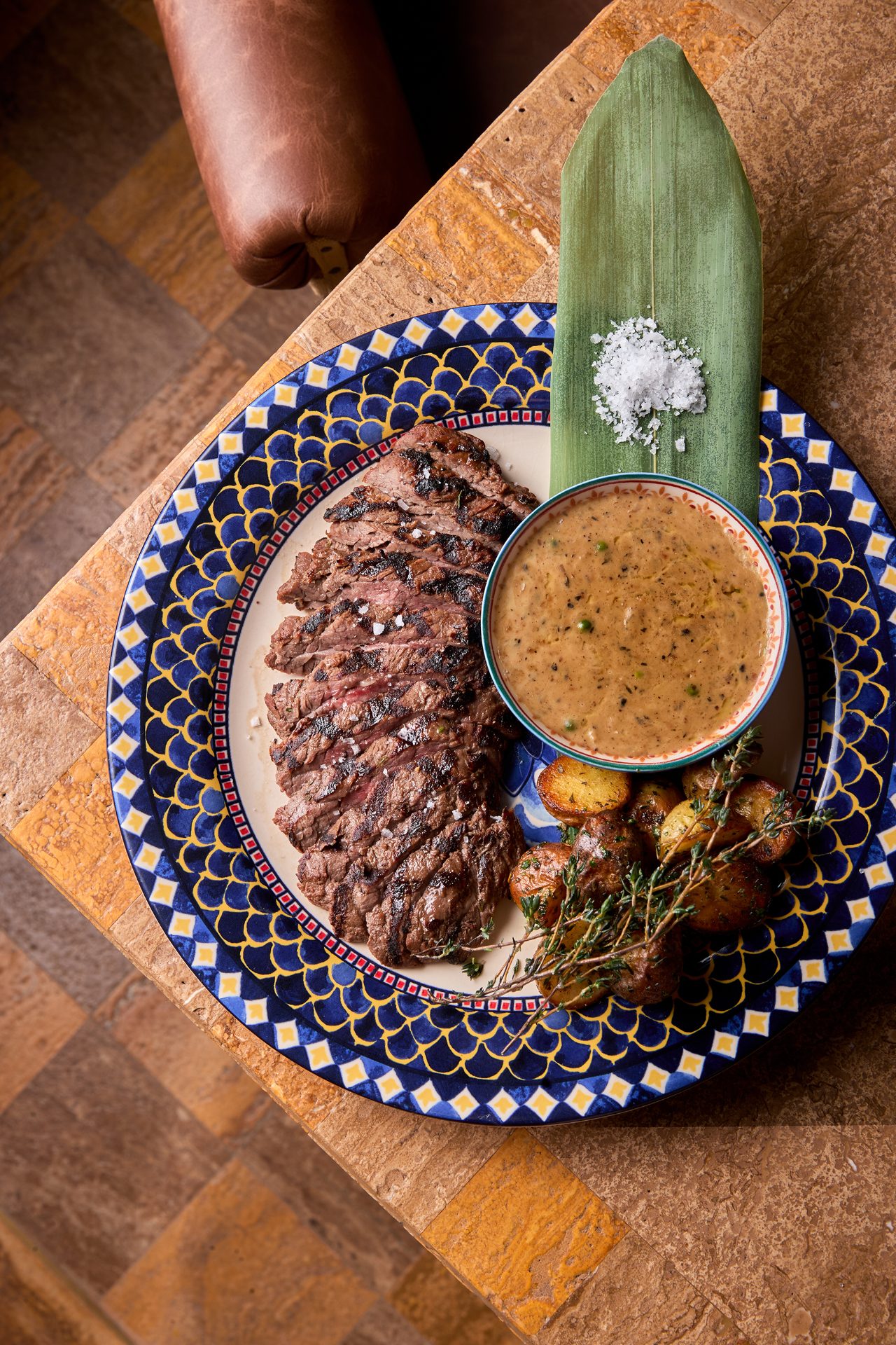 Grilled steak with peppercorn sauce at Mana